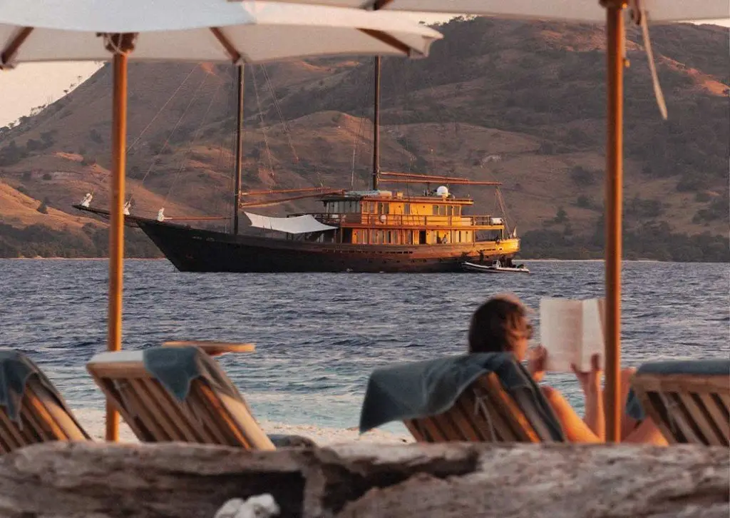 Private yacht at sunset from a beach in Indonesia