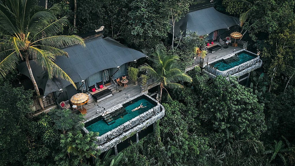 Aerial view of Capella Ubud tented villas with private pools in the jungle