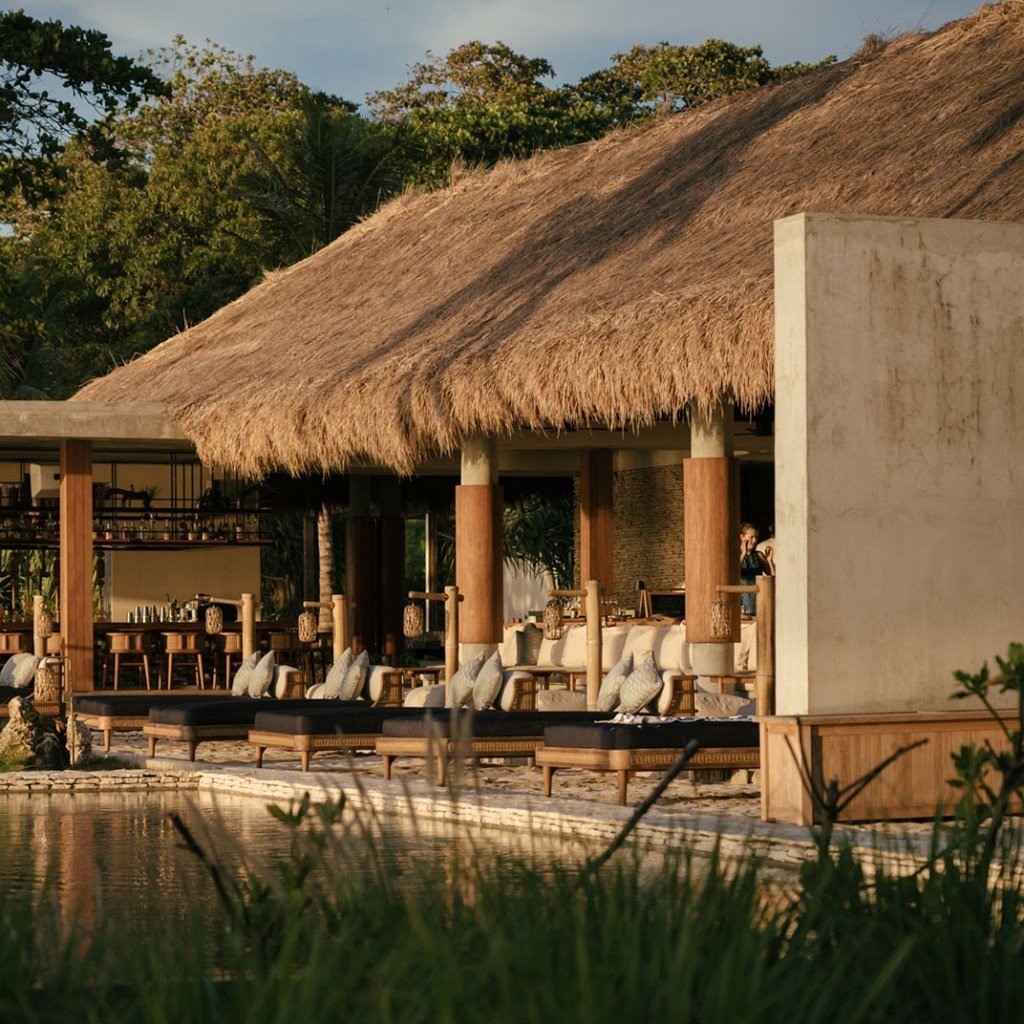 Thatched beach club and daybeds at Cap Karoso