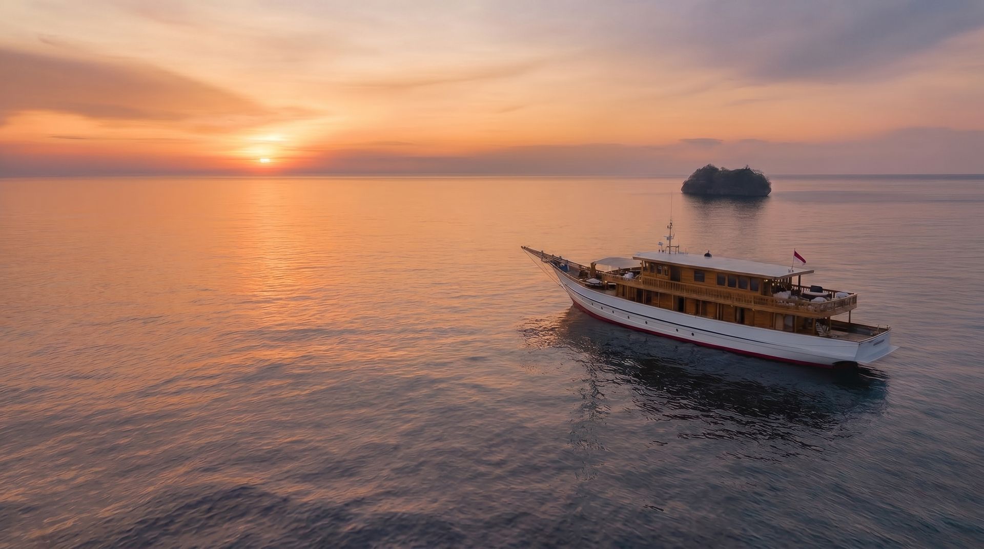 Mahodaya at sunset, a 3-cabin yacht for private charter in Indonesia