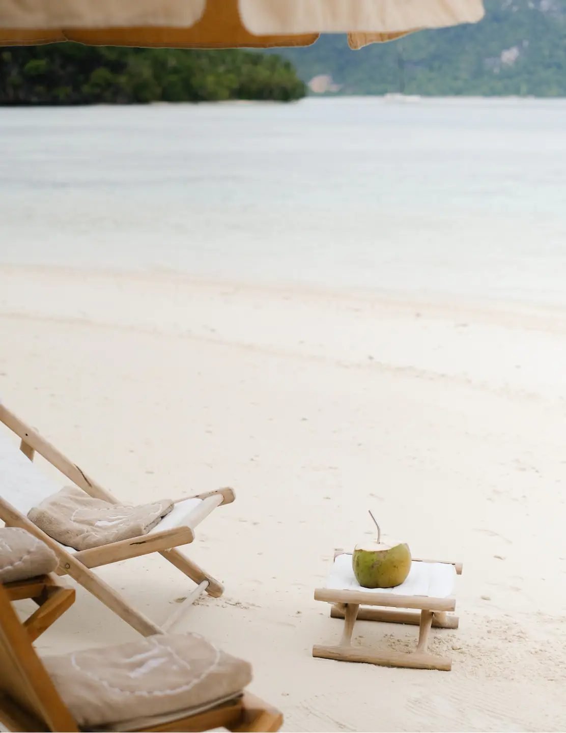 Beach chairs and a coconut set up from Mutiara Laut