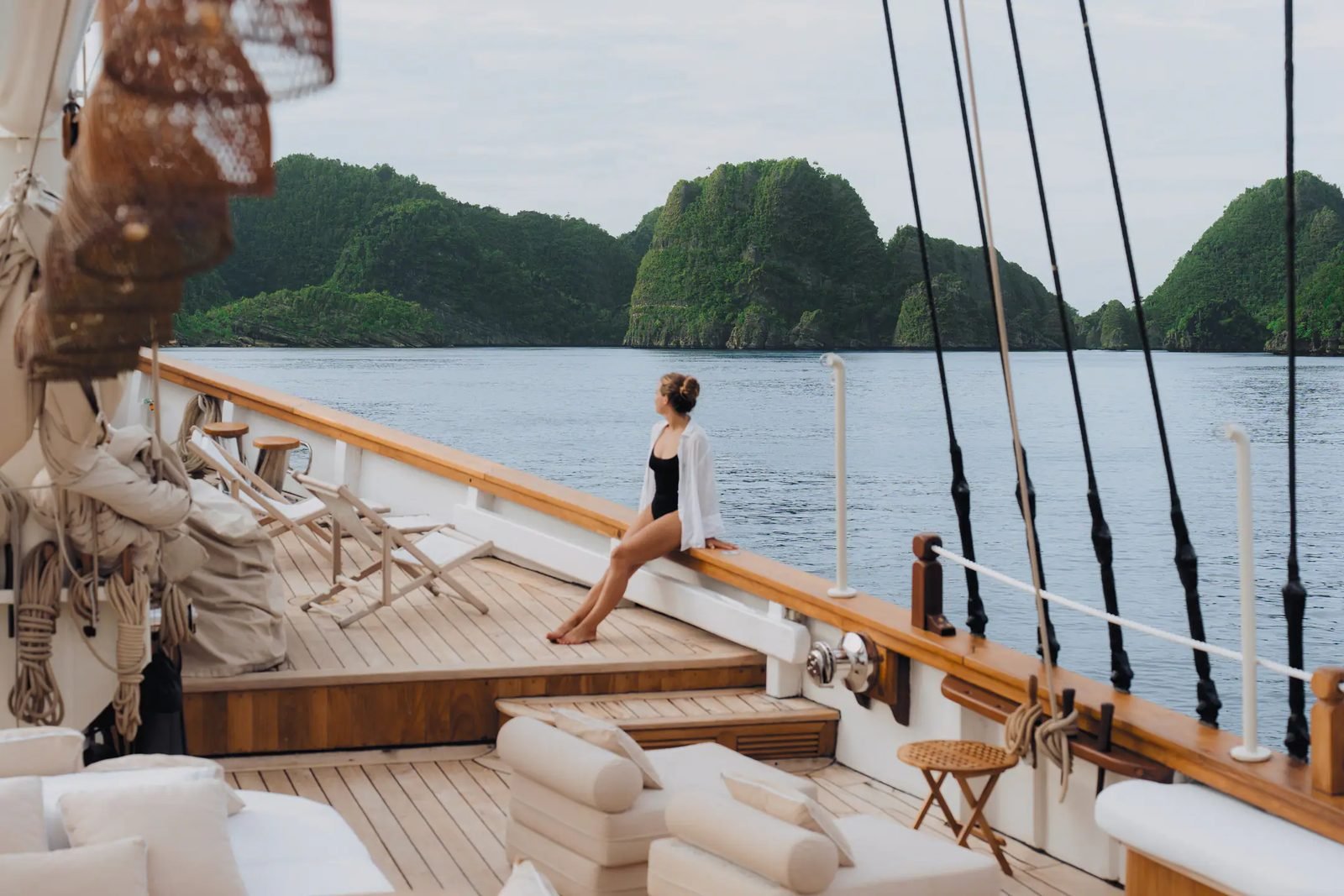 The bow of Mutiara Laut sailing through Indonesian islands