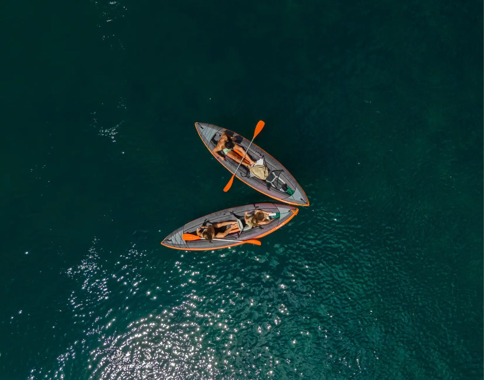 Kayaks alongside Mutiara Laut