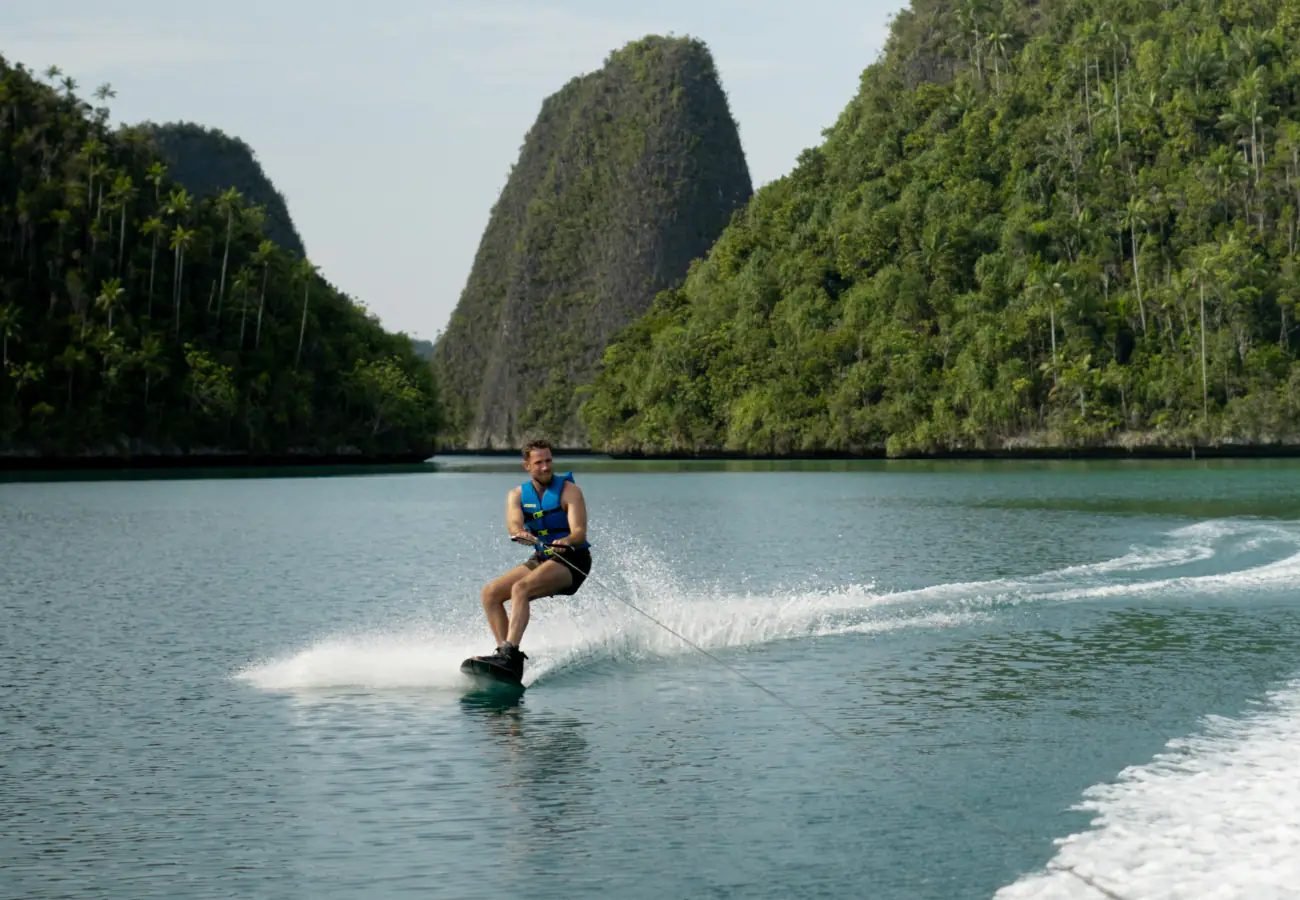A guest paddling beside Mutiara Laut