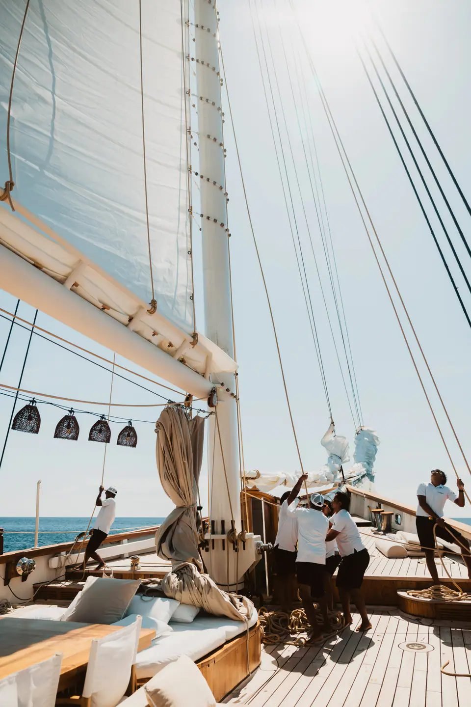 Guests dining on deck as Mutiara Laut sails
