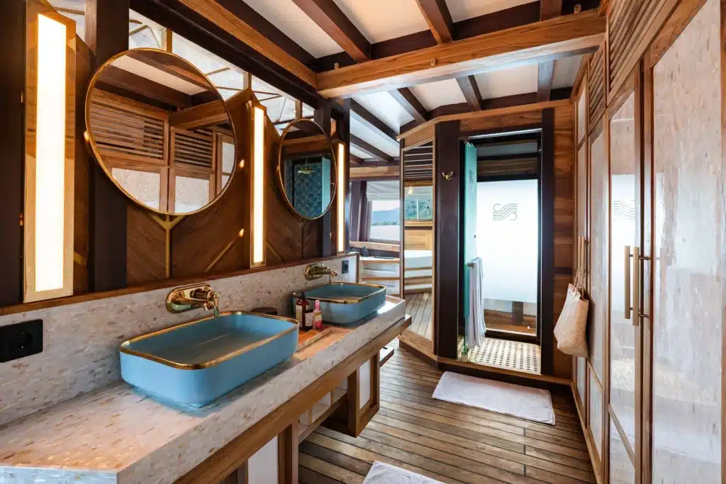 Master bathroom on Otium, with two basins and a shower